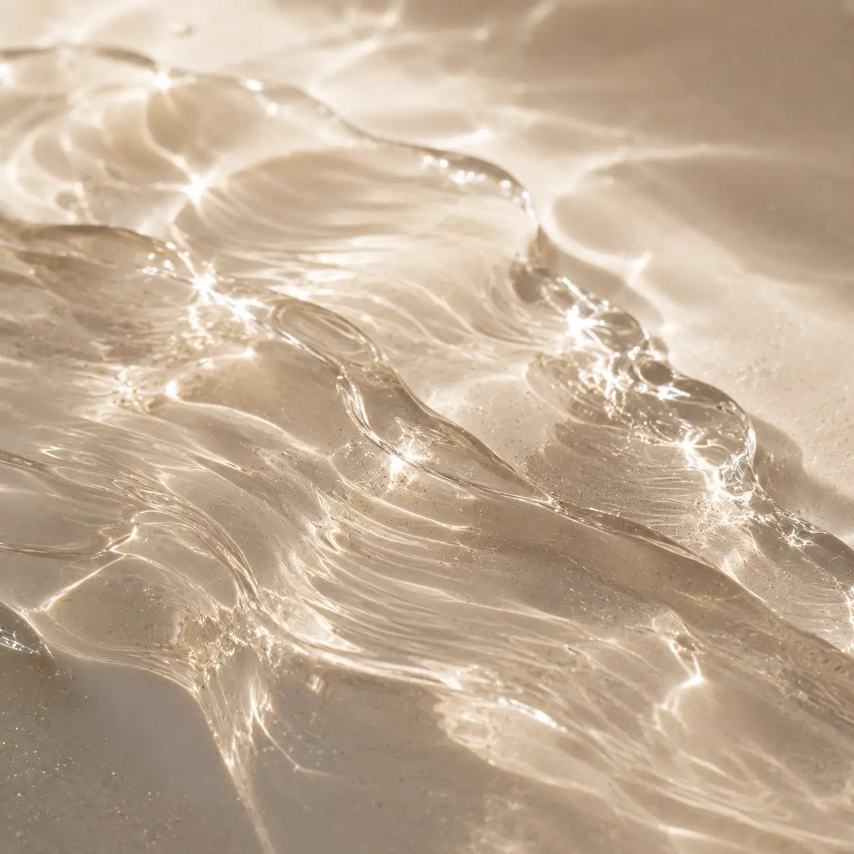 Artistic macro photograph of a translucent marine-inspired skincare texture symbolizing marine ferment and skin barrier protection.