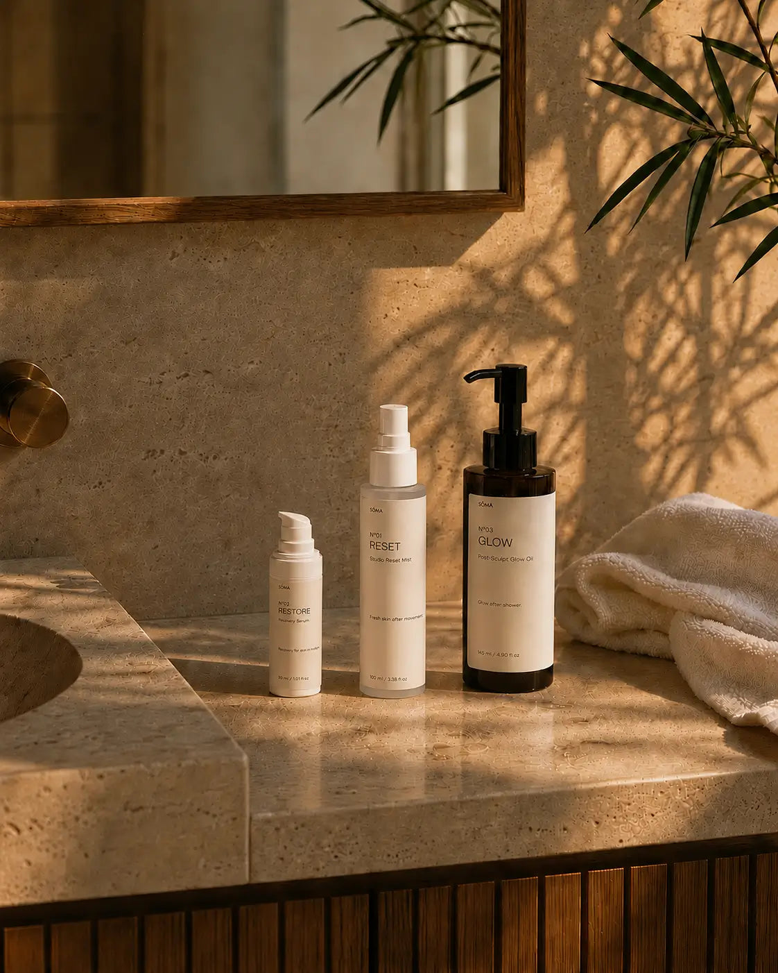 Minimal bathroom featuring the complete SÖMA skincare ritual with RESET facial mist, RESTORE serum and GLOW body oil. Everyday skincare routine designed for healthy-looking skin